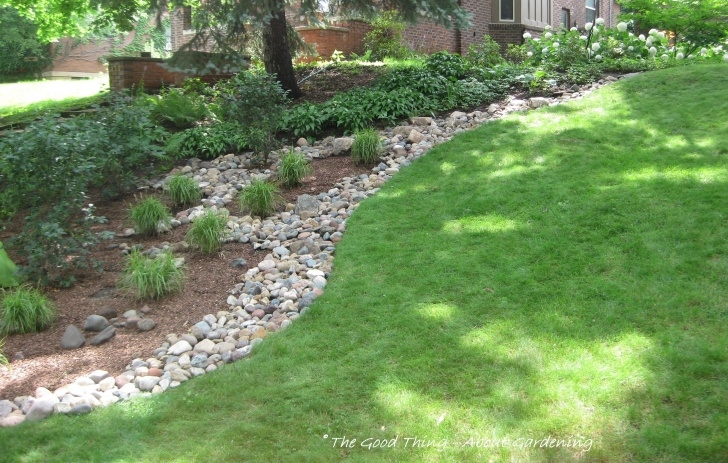 Dry River Bed Front Yard River Rock As A Divider Between The Grass And Plant Beds Picture 303